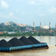 A barge on the Mahakam River with coal from the mining area in Samarinda, East Kalimantan, Indonesia.